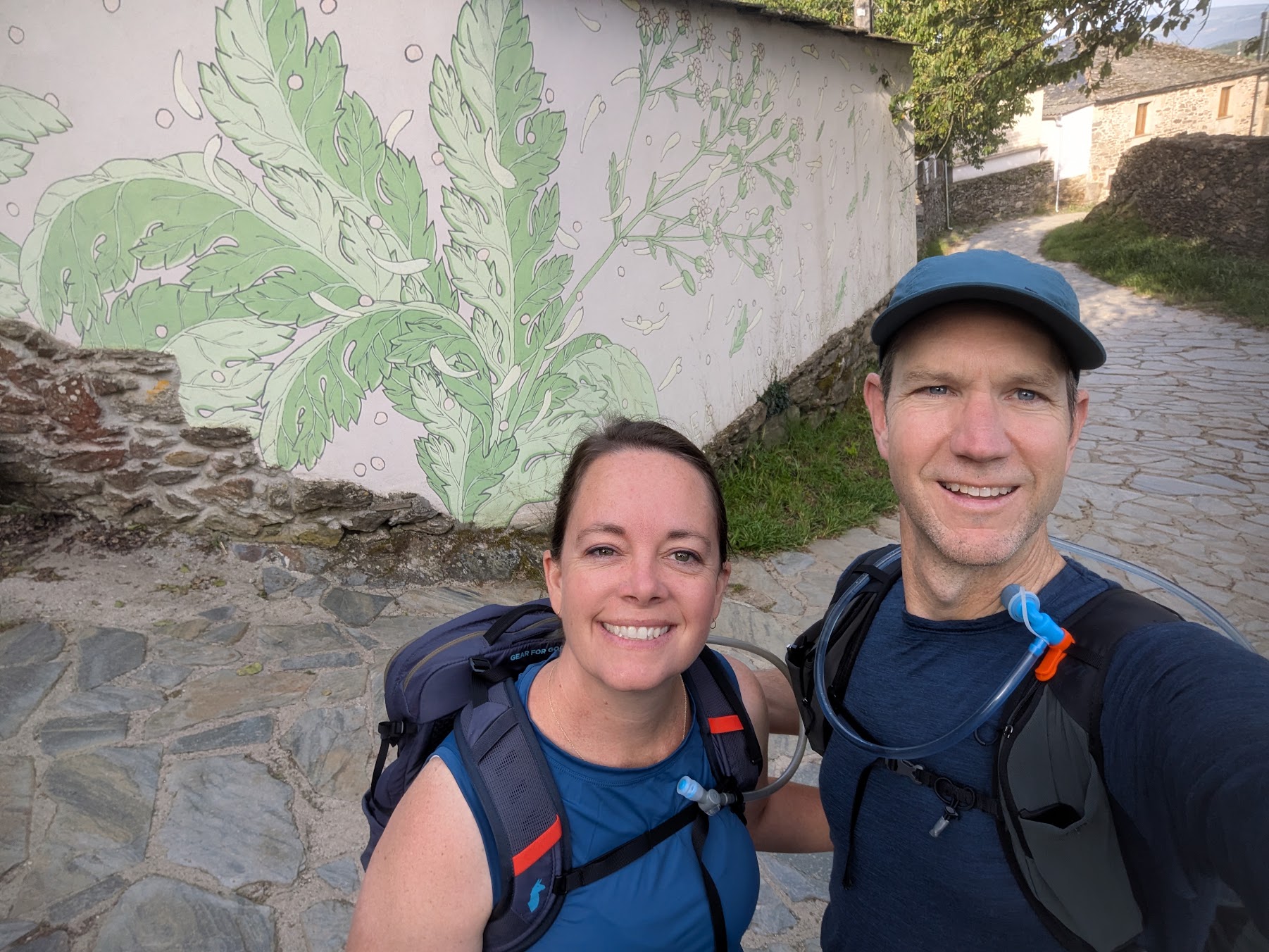 Keri and Ryan Spangler hiking together with their backpacks